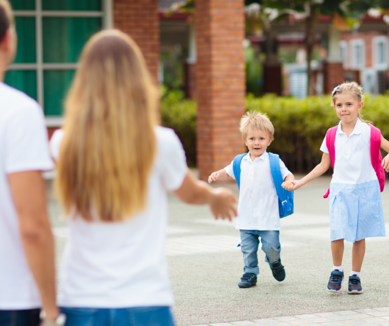 Canva: School Pick up. Mother and Kids after school Getty Images FamVeld